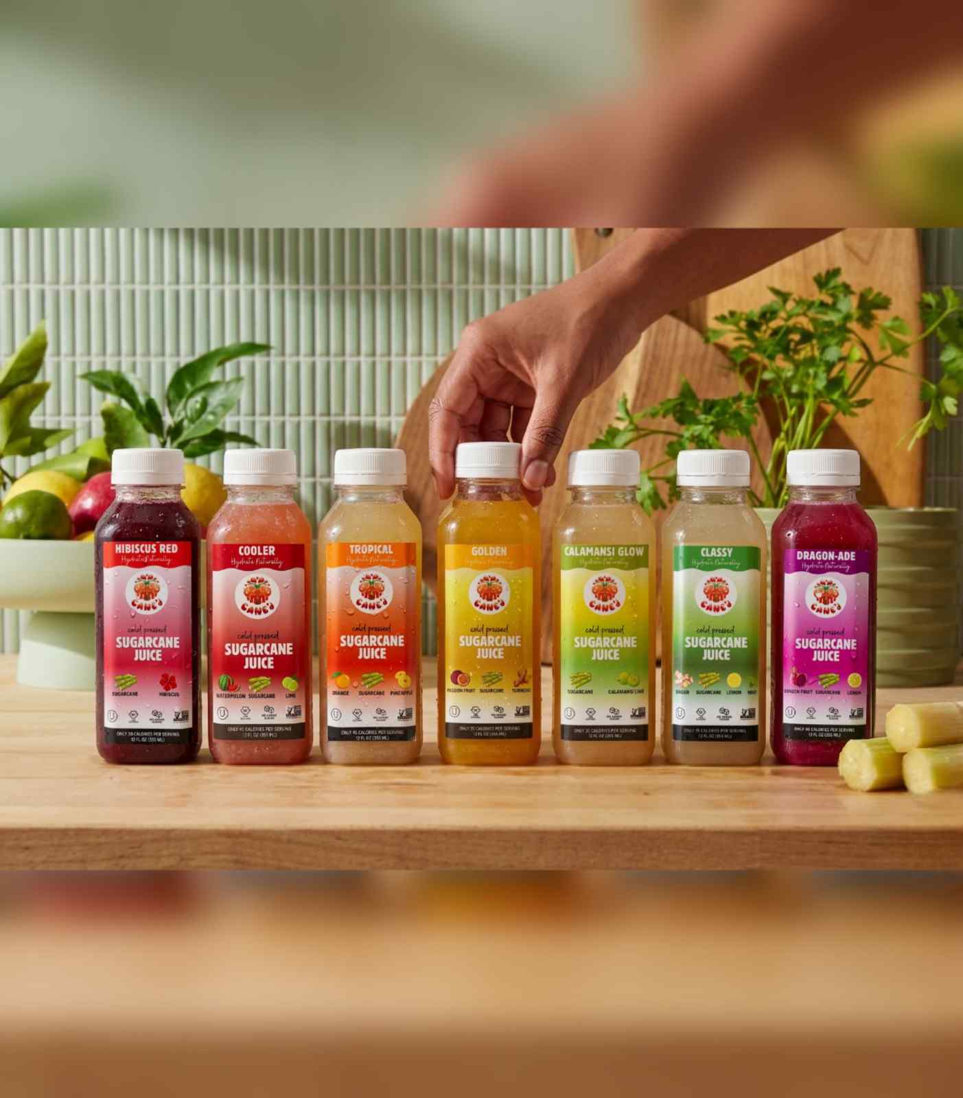 Assorted sugarcane juice bottles on a wooden table with a blurred background
